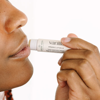 Girl applying Tallow Vera's organic vanilla tallow lip balm