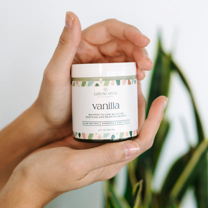 4oz vanilla whipped Tallow Vera tallow moisturizer being held by hands