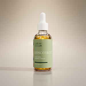 A clear glass bottle with a dropper containing yellow-colored Unscented Aloe Vera Serum, labeled with the brand 'Tallow Vera' and the product name 'Aloe Vera Organic Serum'.