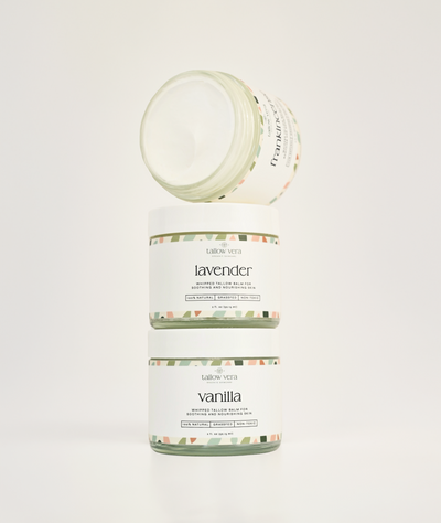 Three jars of lavender, vanilla, and frankincense scented tallow balms on a white background